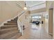 Carpeted staircase leading to the second floor, overlooking the living area at 8828 Monte Oro Dr, Las Vegas, NV 89131