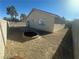 View of the spacious backyard with a fire pit and stone landscaping at 124 Winley Chase Ave, North Las Vegas, NV 89032