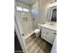 Bathroom featuring a step-in shower with white marble-style tiles at 124 Winley Chase Ave, North Las Vegas, NV 89032