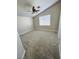 Spacious bedroom with neutral carpet, ceiling fan, and natural light at 124 Winley Chase Ave, North Las Vegas, NV 89032
