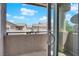 Balcony overlooking community homes under a partly cloudy sky at 2001 Quarry Ridge St # 207, Las Vegas, NV 89117