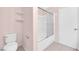 Bathroom featuring a combined shower and tub with sliding glass door and a toilet at 2001 Quarry Ridge St # 207, Las Vegas, NV 89117