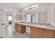 Bathroom with double sinks, large mirror, and tile floors at 2001 Quarry Ridge St # 207, Las Vegas, NV 89117