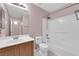 Bathroom featuring a vanity, toilet, and tiled shower with updated fixtures at 2001 Quarry Ridge St # 207, Las Vegas, NV 89117