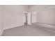 Bedroom featuring neutral walls, tile flooring, open doorway, and mirrored closet doors at 2001 Quarry Ridge St # 207, Las Vegas, NV 89117