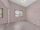 Bedroom with vaulted ceiling, tile floor, window, and large closet with mirrored doors at 2001 Quarry Ridge St # 207, Las Vegas, NV 89117