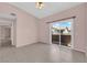 Bedroom with tiled floor and sliding glass door leading to a balcony at 2001 Quarry Ridge St # 207, Las Vegas, NV 89117