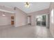 Open living room with tile flooring, access to the outdoor patio, and a view of the community at 2001 Quarry Ridge St # 207, Las Vegas, NV 89117