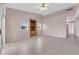 Spacious living room features tile floors, built-in shelving, and plenty of natural light at 2001 Quarry Ridge St # 207, Las Vegas, NV 89117