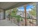 The balcony provides a serene view of community landscaping and nearby residences at 2819 Bluebonnet Dr # 6, Henderson, NV 89074