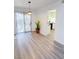 Dining area with sliding door, wood floors, pendant lighting, open to kitchen at 3425 Trilogy Dr, Las Vegas, NV 89108