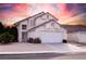 Charming two-story home with a two-car garage, tile roof, and desert landscaping at 3425 Trilogy Dr, Las Vegas, NV 89108