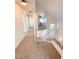 Upstairs hallway with carpet, view of living area, and natural light at 3425 Trilogy Dr, Las Vegas, NV 89108