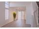 Bright living room with wood floors, large windows, and stylish décor at 3425 Trilogy Dr, Las Vegas, NV 89108