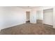 This bedroom has neutral walls, plush carpet, and is right next to a closet at 3508 Rio Robles Dr # A, North Las Vegas, NV 89030