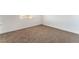 A bright bedroom featuring neutral carpet, white walls, and a window for natural light at 3508 Rio Robles Dr # A, North Las Vegas, NV 89030