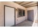 Covered entrance to unit, showcasing security gate and exterior lighting fixture at 3508 Rio Robles Dr # A, North Las Vegas, NV 89030