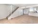 Spacious living area with staircase and tile flooring leading to kitchen at 3508 Rio Robles Dr # A, North Las Vegas, NV 89030