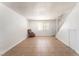 Bright living area with tile flooring, staircase, and a large window at 3508 Rio Robles Dr # A, North Las Vegas, NV 89030