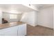 Spacious living room features neutral tile flooring, lots of natural light, and access to stairs at 3508 Rio Robles Dr # A, North Las Vegas, NV 89030