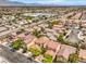 Overhead view of neighborhood with tree lined streets and desert landscape at 3728 Ashling St, Las Vegas, NV 89129