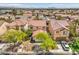 Aerial view of a neighborhood home with mature trees and tile roof at 3728 Ashling St, Las Vegas, NV 89129