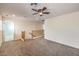 Spacious bonus room featuring neutral carpet, ceiling fan and railing overlooking downstairs at 3728 Ashling St, Las Vegas, NV 89129