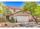 Charming home featuring desert landscaping, a tile roof, and an attached garage at 3728 Ashling St, Las Vegas, NV 89129