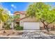 Two-story home showcasing a well-maintained yard and two-car garage at 3728 Ashling St, Las Vegas, NV 89129