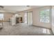 Living room featuring carpet and sliding glass doors to the backyard at 3728 Ashling St, Las Vegas, NV 89129