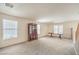 Spacious living room with neutral carpet, natural light, and traditional furnishings at 3728 Ashling St, Las Vegas, NV 89129