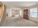 Bright living room with carpet, staircase, and traditional cabinet at 3728 Ashling St, Las Vegas, NV 89129
