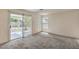 Bright living room with sliding glass doors providing access to a patio at 3728 Ashling St, Las Vegas, NV 89129