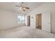 Spacious main bedroom with large window and neutral carpet, adjoined by a walk-in closet at 3728 Ashling St, Las Vegas, NV 89129