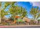 Neighborhood playground with mature trees, slide, and play structure at 3728 Ashling St, Las Vegas, NV 89129