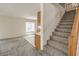 Carpeted stairs lead from an open concept living room with views of the kitchen at 3728 Ashling St, Las Vegas, NV 89129