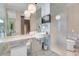 Luxurious bathroom with marble accents, a glass-enclosed shower, and double sinks at 4381 W Flamingo Rd # 1109, Las Vegas, NV 89103