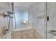 Modern bathroom featuring a shower with soaking tub, white tile, and sleek fixtures at 4381 W Flamingo Rd # 1109, Las Vegas, NV 89103
