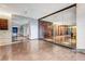 Hallway leading to Drift Spa with glass partition highlighting wine selections and decor at 4381 W Flamingo Rd # 1109, Las Vegas, NV 89103