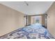 Hallway with patterned carpet, two elevators, and natural light with city views in the distance at 4381 W Flamingo Rd # 1109, Las Vegas, NV 89103