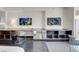 Modern Living Area Featuring a large desk, TV, and stylish chair at 4381 W Flamingo Rd # 1109, Las Vegas, NV 89103