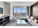Stylish living room with city views, contemporary furniture, and a sleek design for upscale living at 4381 W Flamingo Rd # 1109, Las Vegas, NV 89103