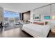 Spacious bedroom with a large window offering city views, contemporary furnishings, and a king-size bed at 4381 W Flamingo Rd # 1109, Las Vegas, NV 89103