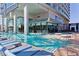 Contemporary pool and spa area with luxurious lounge chairs and tables in the sun at 4381 W Flamingo Rd # 1109, Las Vegas, NV 89103