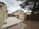 Backyard featuring a concrete patio, a small shed, and decorative swing at 4484 Warbonnet Way, Las Vegas, NV 89147