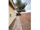 Backyard with paver and gravel path at 4484 Warbonnet Way, Las Vegas, NV 89147