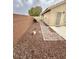 Narrow backyard path at 4484 Warbonnet Way, Las Vegas, NV 89147