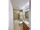 Bathroom with tile flooring, shower-tub combo, granite countertops, and neutral paint at 4484 Warbonnet Way, Las Vegas, NV 89147