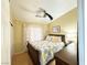 Bedroom with ceiling fan, wood-look flooring, neutral paint, and bright light at 4484 Warbonnet Way, Las Vegas, NV 89147