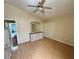 Bedroom with wood-look flooring, ceiling fan, neutral paint, and standard closet at 4484 Warbonnet Way, Las Vegas, NV 89147